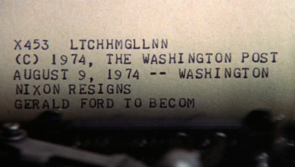 A teletype machine typing out a headline that Nixon resigns and Gerald Ford becomes President. Screenshot from All the President's Men