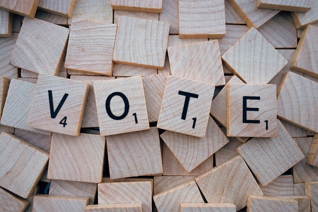 Scrabble tiles spelling "Vote." Vote every year, not just every four years.