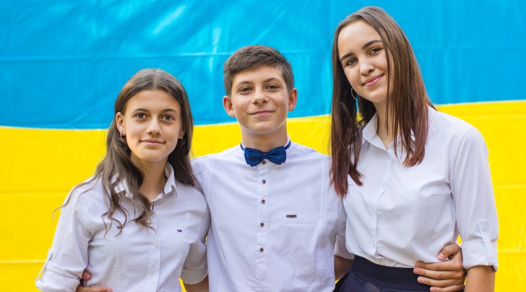Three young people in formal dress. Give students opportunities to serve in governance positions like student councils and youth advisory councils.