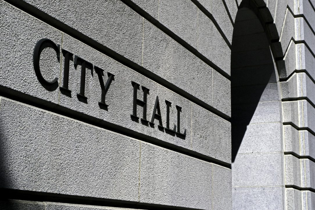 Picture of a building with the words "City Hall"