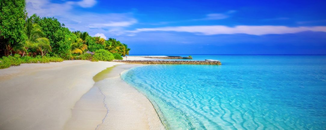 A photo of a beach in the summer.